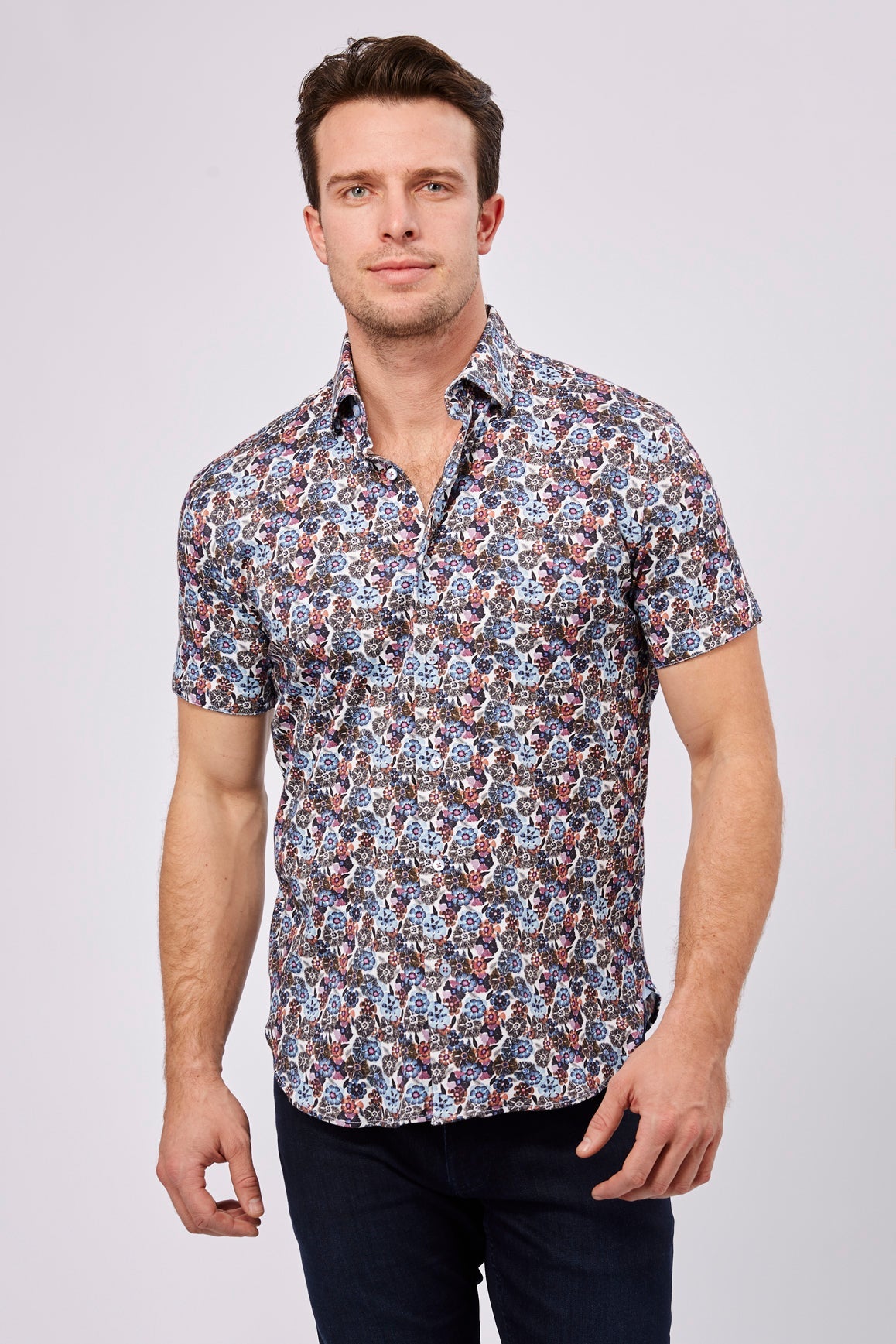 Max Colton White with Black, Purple, Orange, Magenta, Blue and Navy Flowers Short Sleeve Jersey Knit