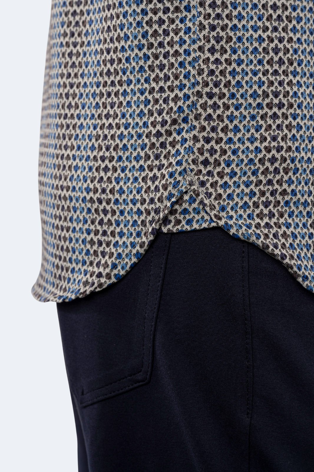 Close-up of a patterned shirt with a plain background