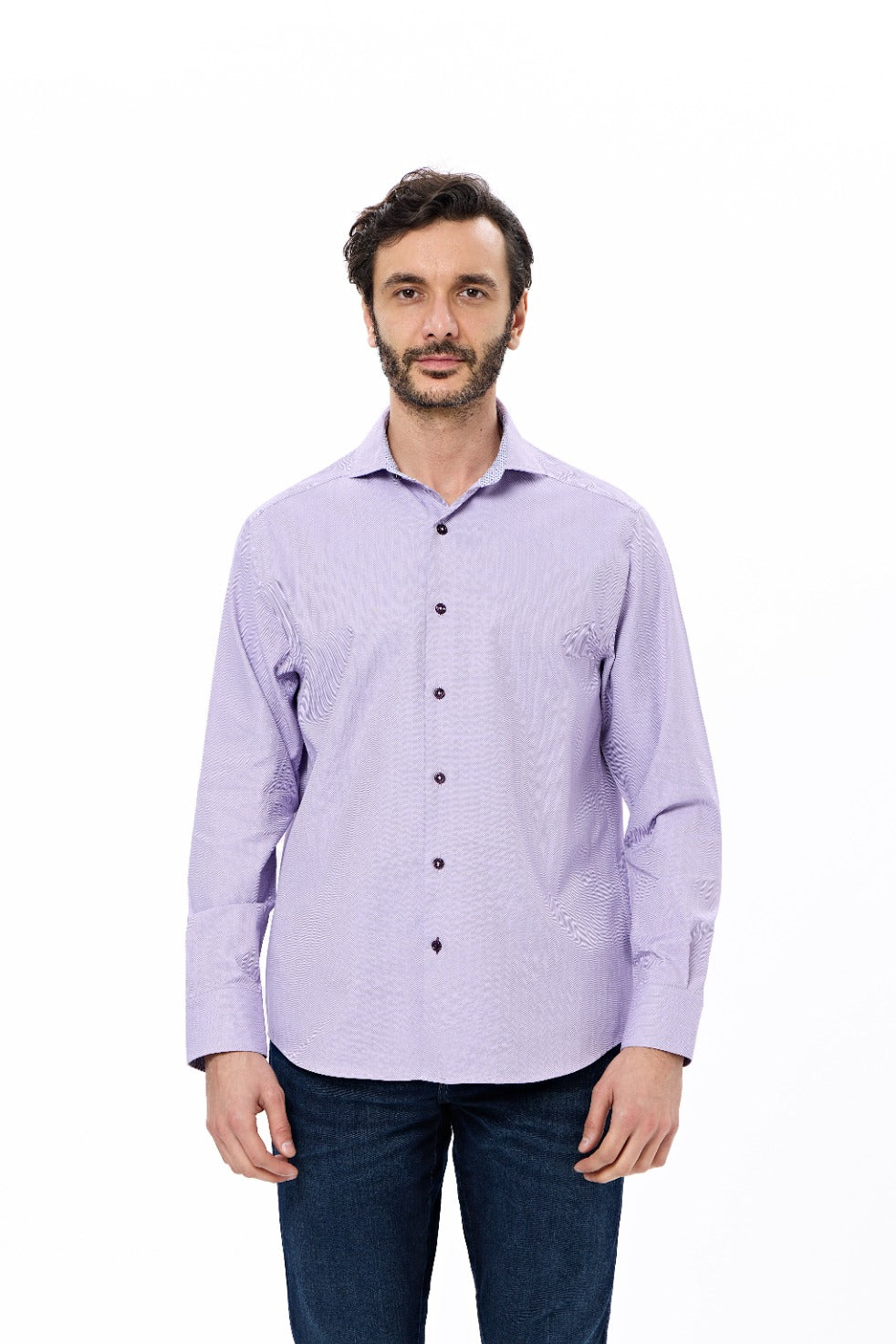Man wearing a light purple button-up shirt with a subtle pattern on a white background